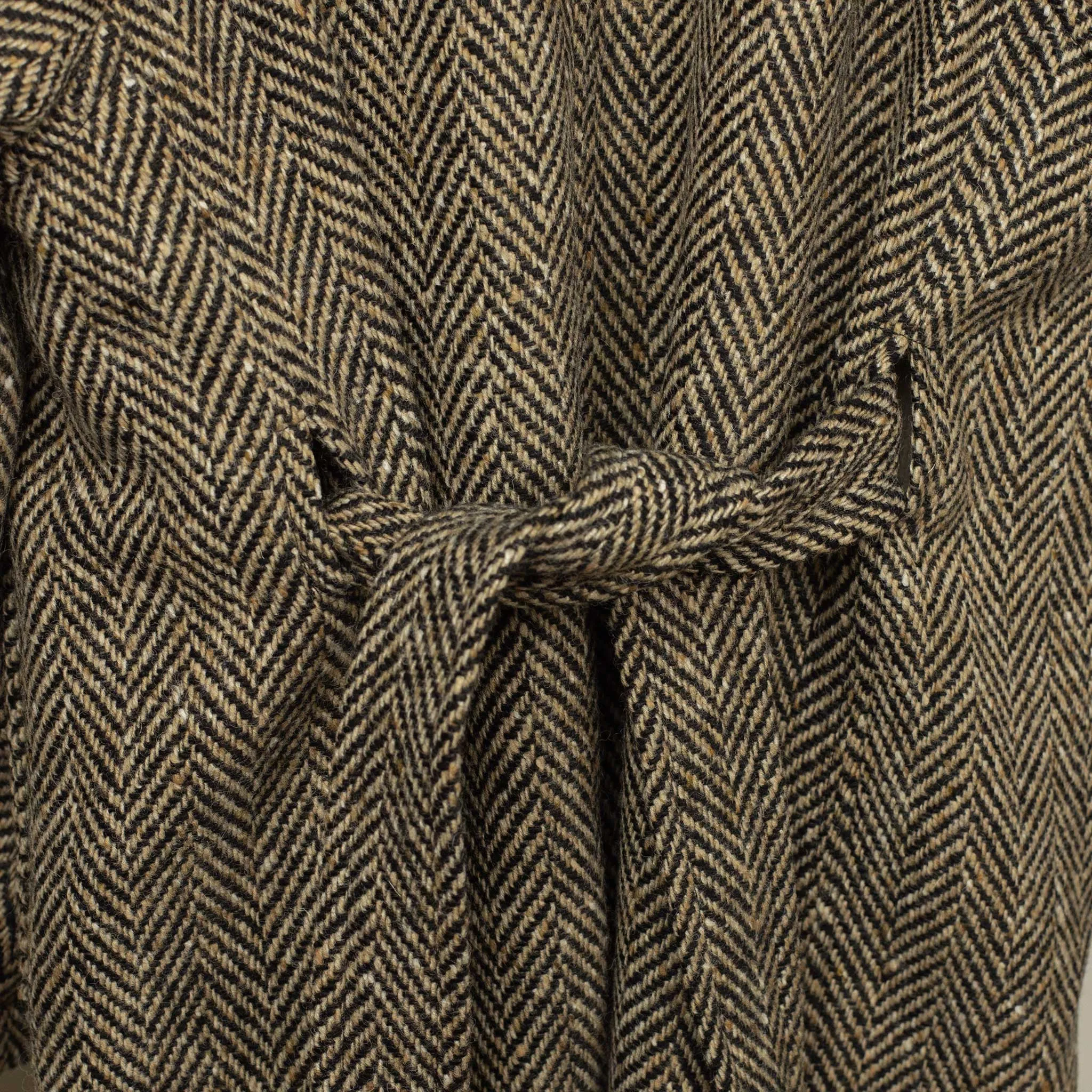 Belted balmacaan in oatmeal and black herringbone wool donegal tweed