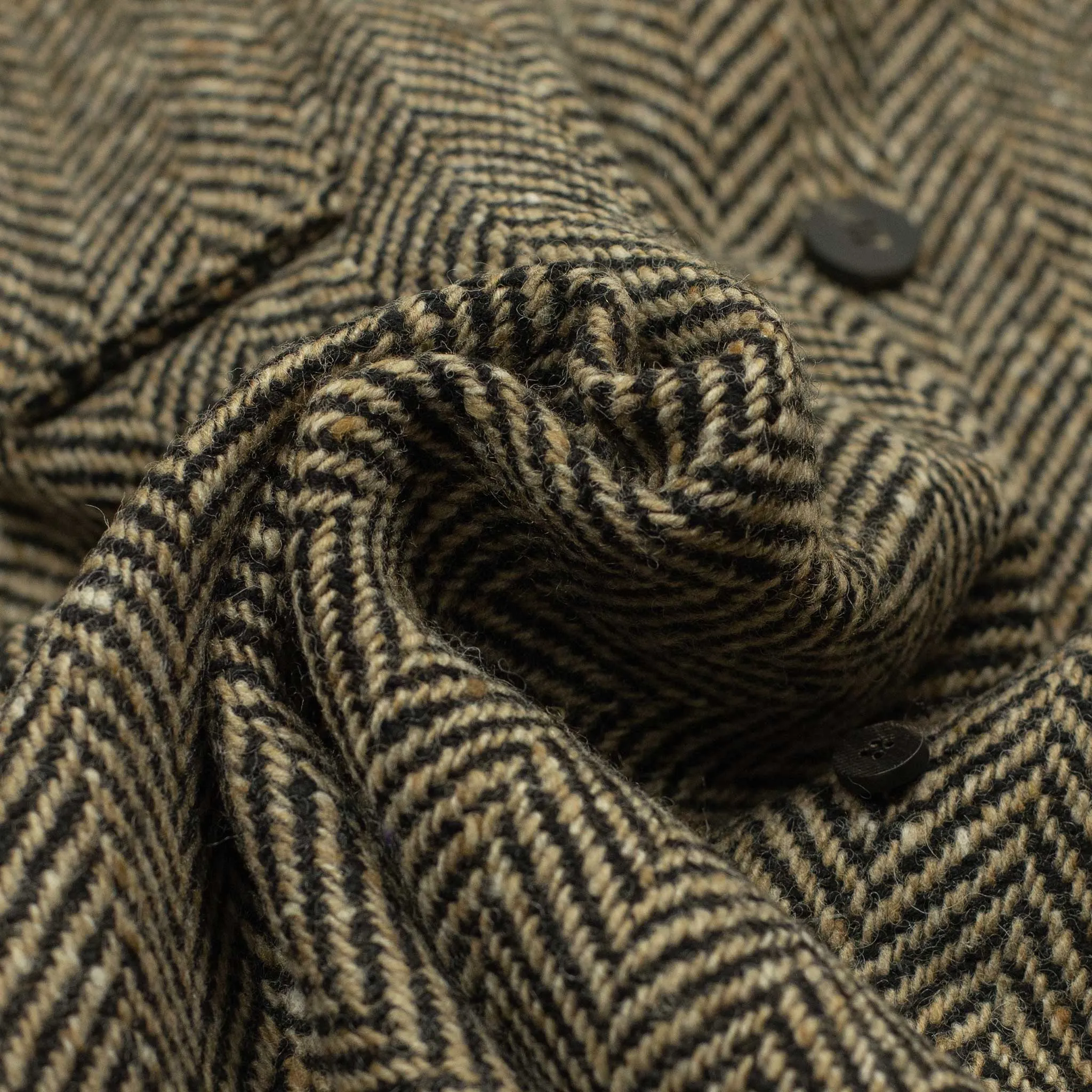 Belted balmacaan in oatmeal and black herringbone wool donegal tweed