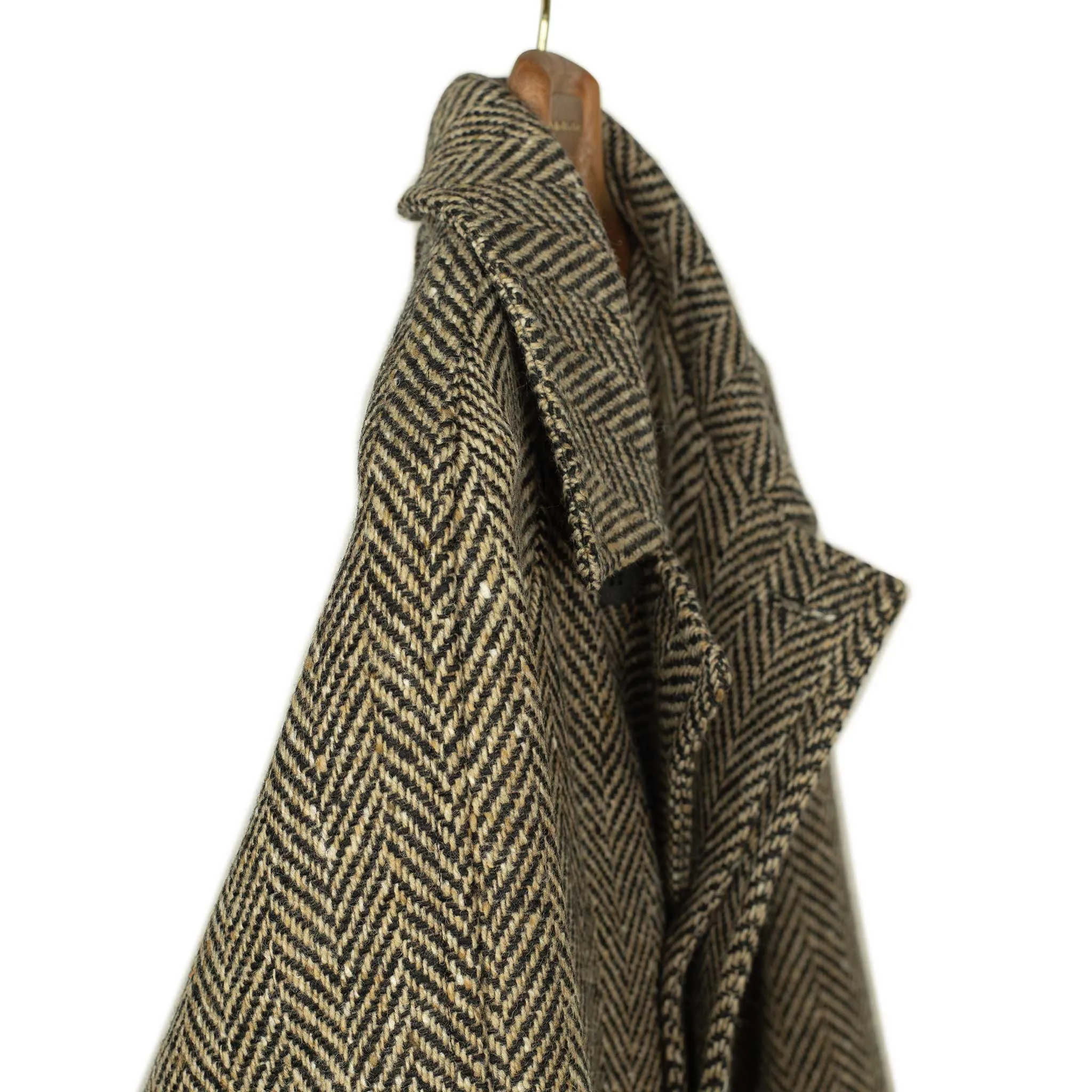 Belted balmacaan in oatmeal and black herringbone wool donegal tweed